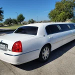 Right side of Lux Line Transportation's white lincoln limousine that holds up to 8 passengers