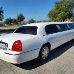 passenger side of Lux Line Transportation's white lincoln limousine that holds up to 8 passengers
